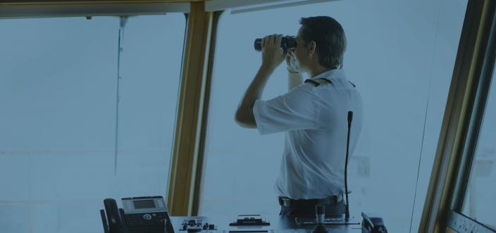 captain looking in a binocular