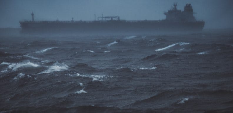Cargo boat sailing in a rough sea
