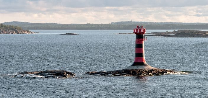 Automatic lighthouse on a small island in the archipelago of the Aland Islands, Finland shutterstock_102434890