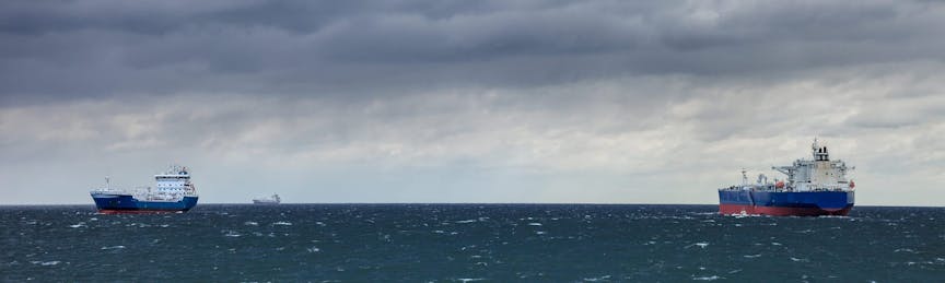 Two ships at sea and the upcoming storm. shutterstock_107253008
