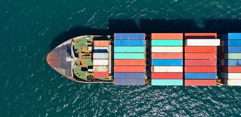 Aerial drone photo of industrial truck size container cargo ship_shutterstock_1726729180