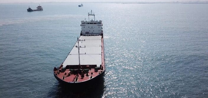 Large bulk carrier general cargo ship sailing / docking in open ocean_shutterstock_707658898