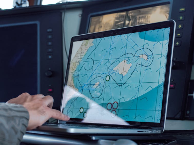 Captain,Of,Commercial,Fishing,Ship,Surrounded,By,Monitors,And,Screens