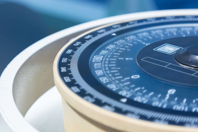 Compass aboard a ship on a blue summer sea.