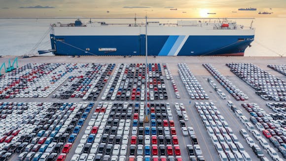 Aerial view vehicle carrier vessel loading car for shipping to worldwide, Large RoRo (Roll on/off) vehicle car carrier, New car lined up in the port for import export around the world.